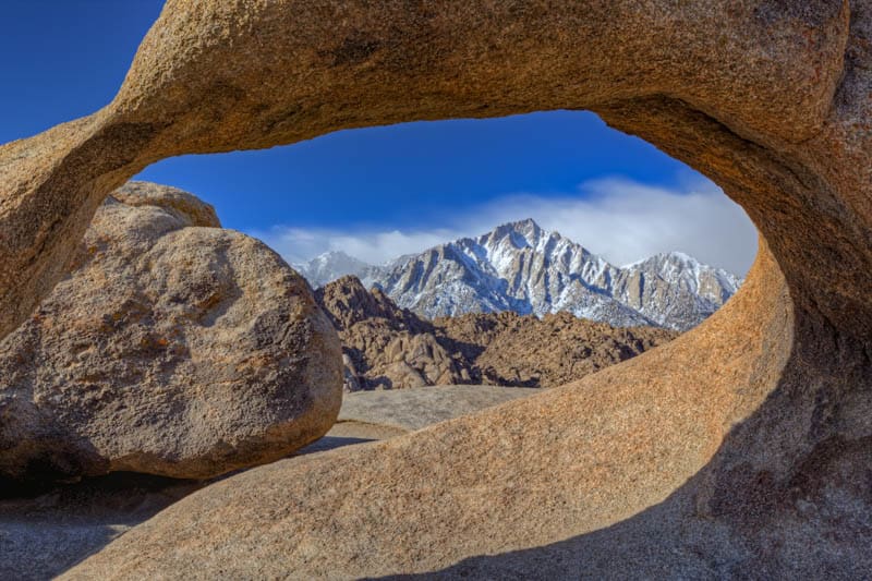 Lone Pine Peak seen through an arch in the Alabama Hills California