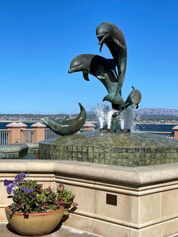 Dolphin sculpture and fountain at Cannery Row in Monterey California