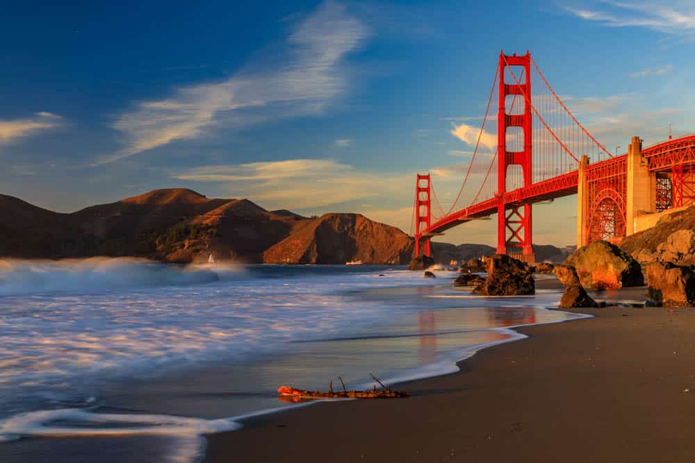 The Golden Gate Bridge at sunset from Marshalls Beach in San Francisco, CA